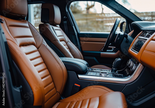 A photo of the interior seats in brown leather, modern style with black details and grey color accents, front view © Ikhou