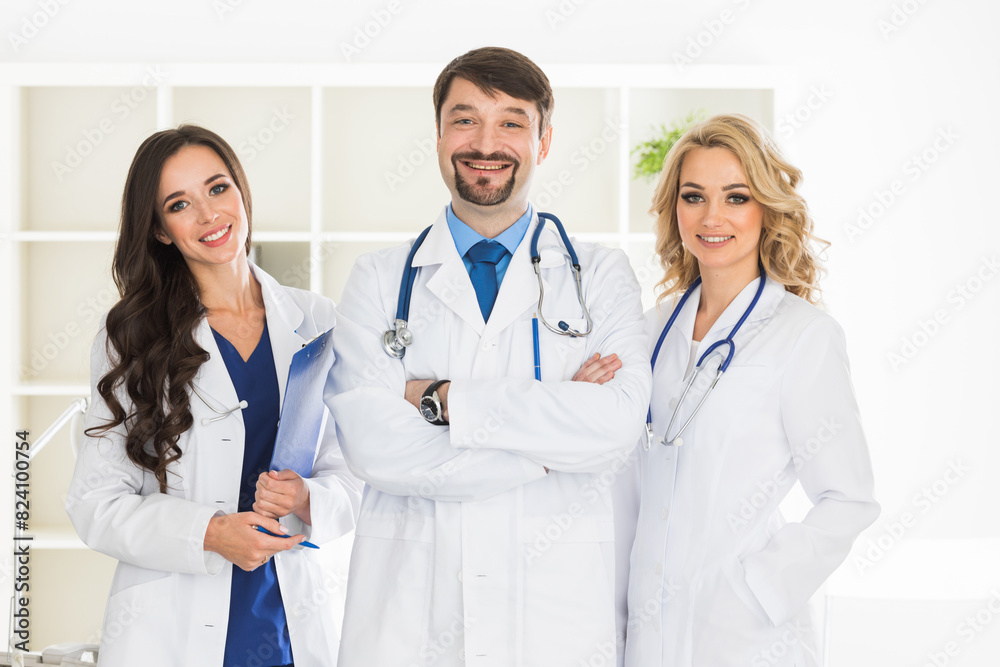 Doctors stand shoulder to shoulder