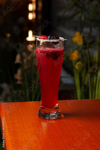 Variety of cocktails in an elegant bar decorated with bottles and sunflowers.  photo