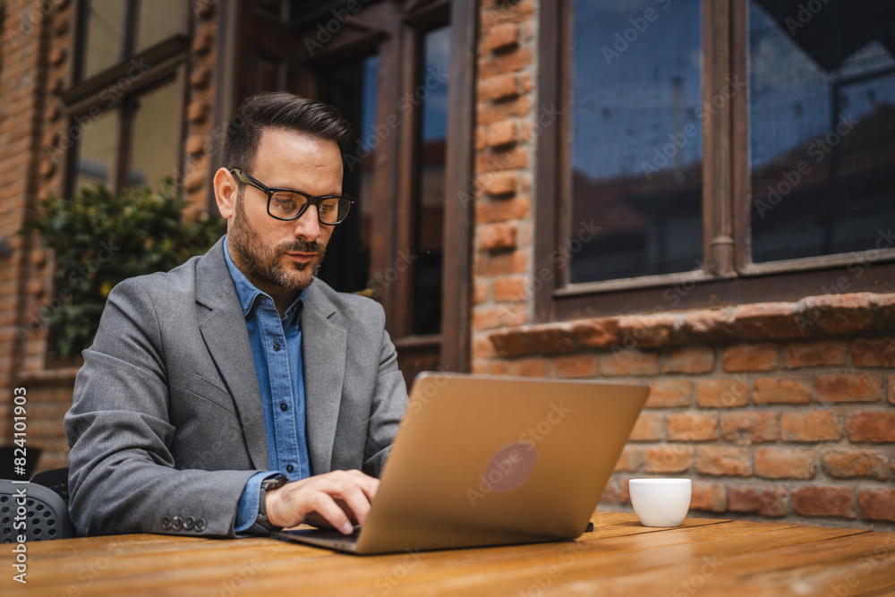 Adult man use laptop for work or browse internet in cafe restaurant Adult man use laptop for work or browse internet in cafe restaurant