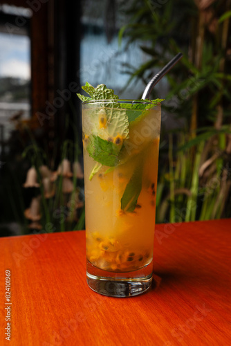 Variety of cocktails in an elegant bar decorated with bottles and sunflowers.  photo