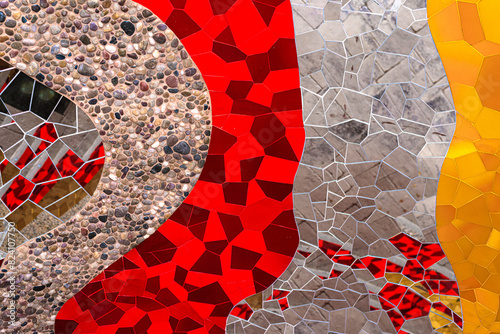 Abstract wall art glass crystals, pebble stones mosaic elements decoration. Detail of red, orange, yellow, gold, glass silver color waves of ornamental abstract mosaic art patterns texture background.