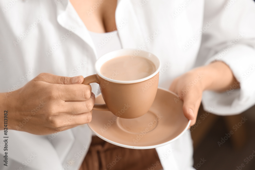 Woman with cup of hot coffee at home, closeup Woman with cup of hot coffee at home, closeup