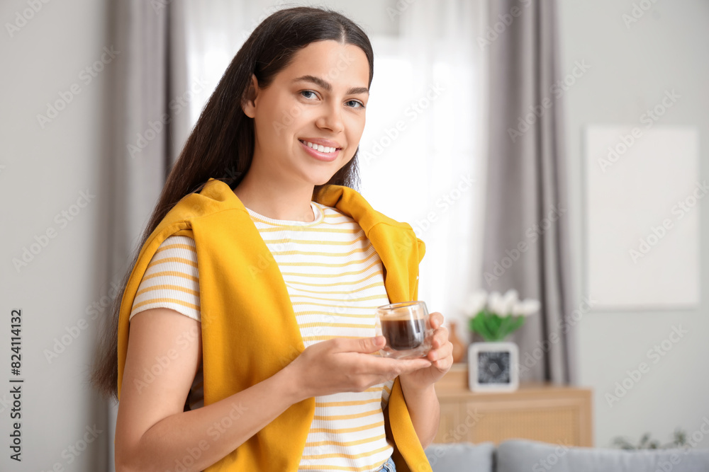 Pretty young woman with cup of hot coffee at home Pretty young woman with cup of hot coffee at home