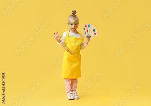 Cute little girl in paint w...