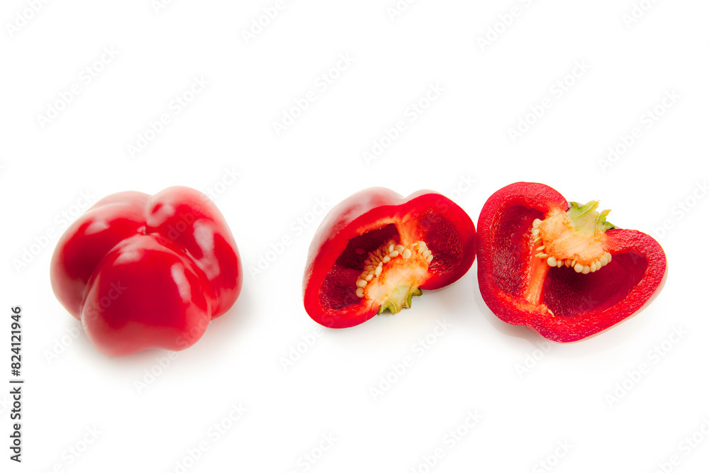 Whole and half of red bell pepper isolated on white background with clipping path. . Whole and half of red bell pepper isolated on white background with clipping path. .