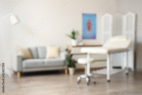 Blurred view of medical office with sofa and couch