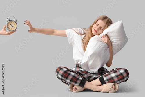 Young woman with pillow suf...