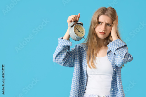 Young woman in pajamas with...