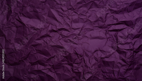 Crinkled dark purple paper texture background photo