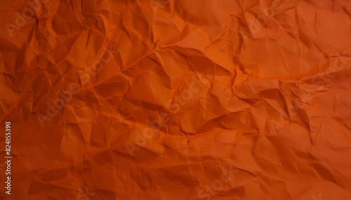 Crinkled dark orange paper texture background