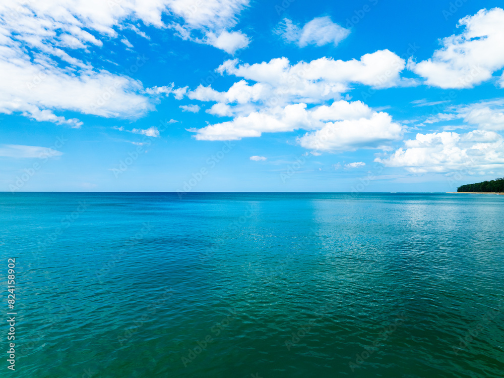 Aerial view of a blue sea surface water texture background,Sun reflections over ocean, Aerial flying drone view Waves water surface texture on sunny tropical ocean in Phuket island Thailand Aerial view of a blue sea surface water texture background,Sun reflections over ocean, Aerial flying drone view Waves water surface texture on sunny tropical ocean in Phuket island Thailand