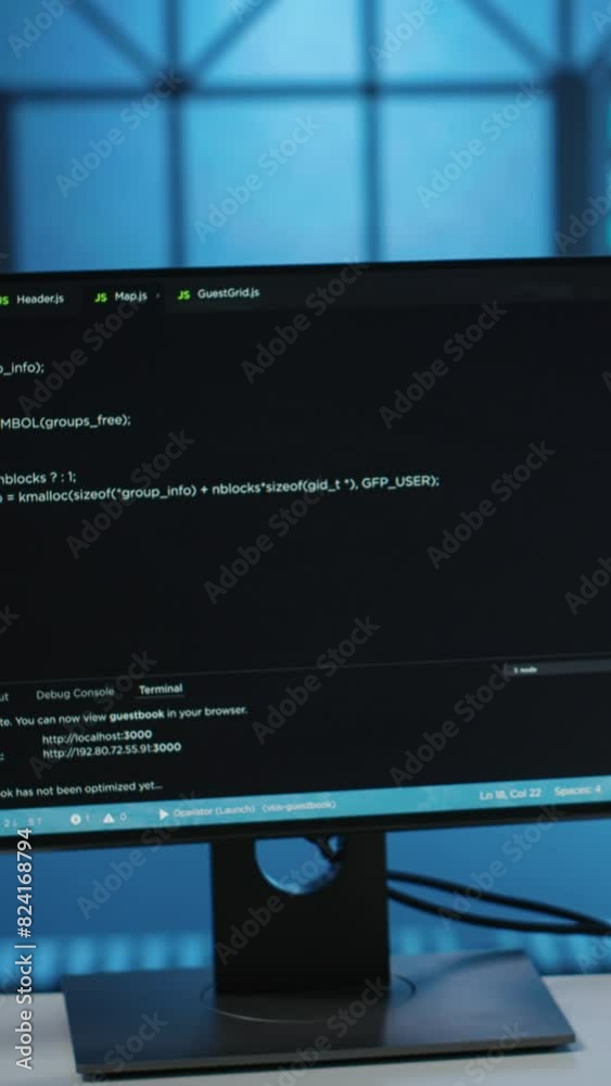 Vertical video Computers in empty data center facility managing rackmounts energy consumption. Close up of script on PC monitors used for automation and monitoring processes in server room, camera B