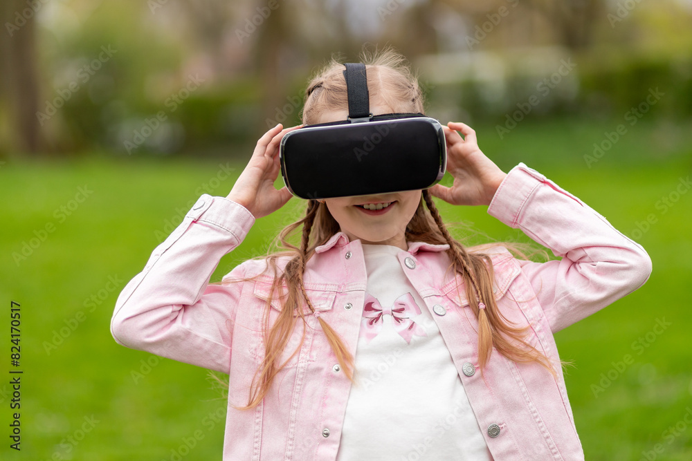 Little girl interacts with virtual reality in park Little girl interacts with virtual reality in park