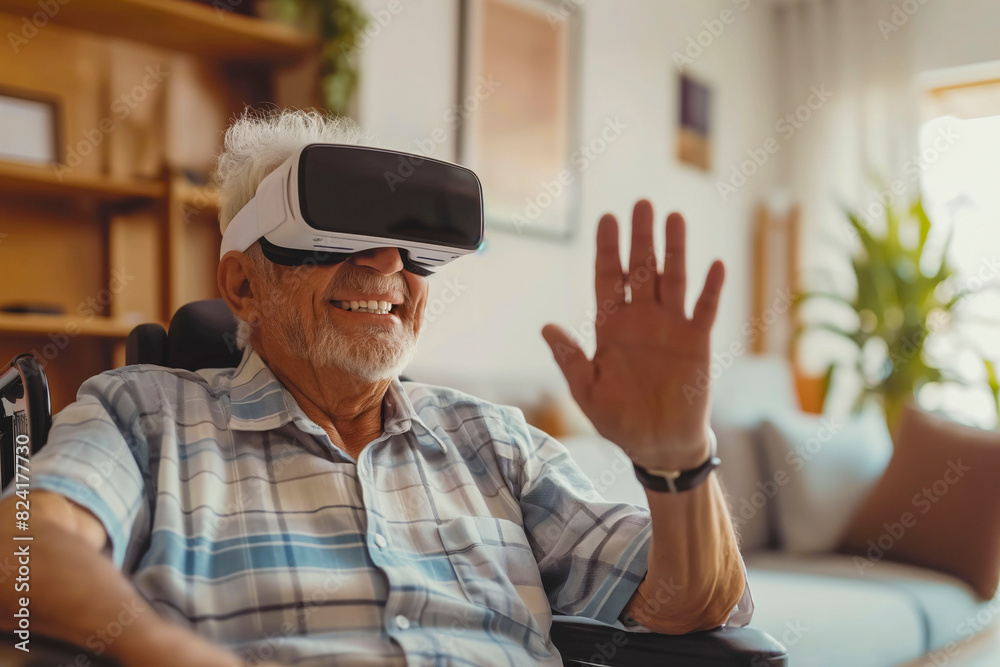 Cheerful disabled senior man in a wheelchair gesturing and smiling while wearing the virtual reality goggles at home in the living room Cheerful disabled senior man in a wheelchair gesturing and smiling while wearing the virtual reality goggles at home in the living room