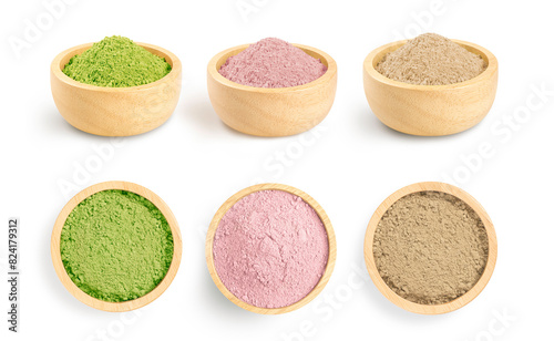 Dry powder plant collection in wooden bowl isolated on white background.