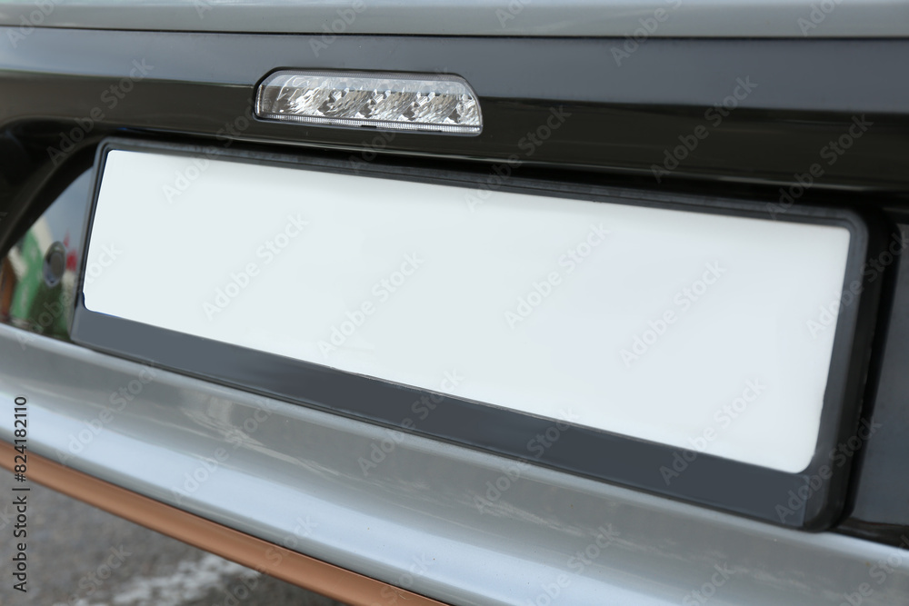 Car with vehicle registration plate, closeup view Car with vehicle registration plate, closeup view