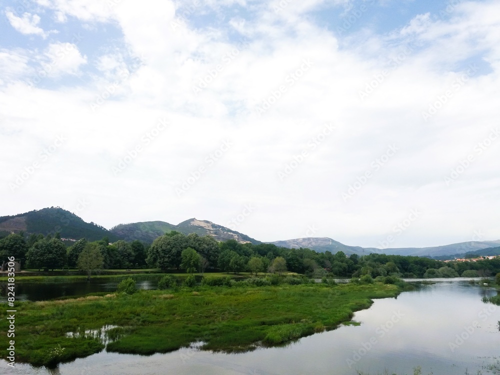 Natural landscape. A lake surrounded by woods Natural landscape. A lake surrounded by woods