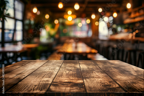 Wood table top on blurred restaurant interior background
