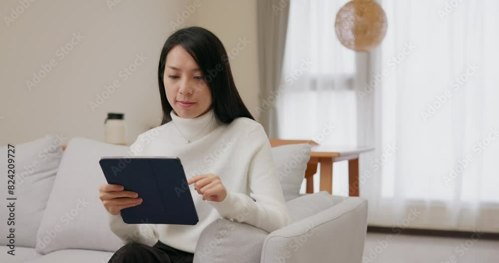 Woman work on digital tablet computer at home Woman work on digital tablet computer at home