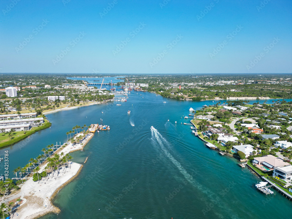 Boats heading out to sea from the intracoastal waterway near Jupiter Inlet in Palm Beach County, Florida