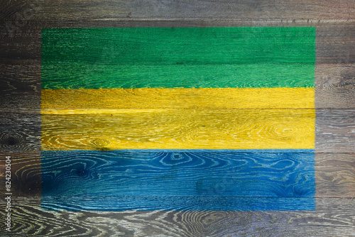 Gabon flag on rustic old wood