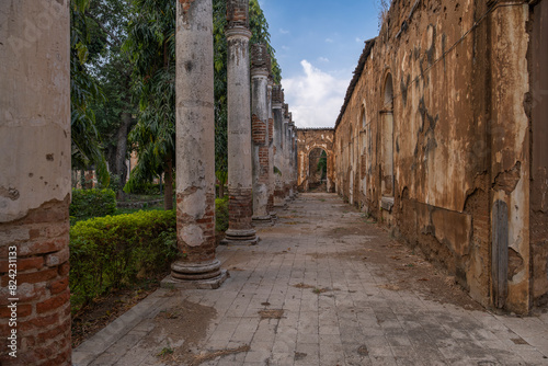 Abandoned old crumbling red brick colonial building. Old school of arts in Santa Ana  El Salvador.