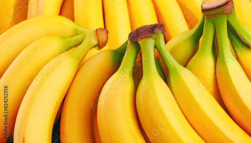 Image of multiple unpeeled banana bunches photo