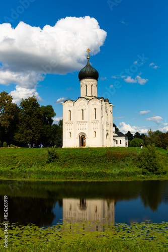 View of Orthodox Church of Intercession of Holy Virgin on Nerl River in Russian village of Bogolyubovo on sunny summer day, Suzdal district, Vladimir Oblast photo