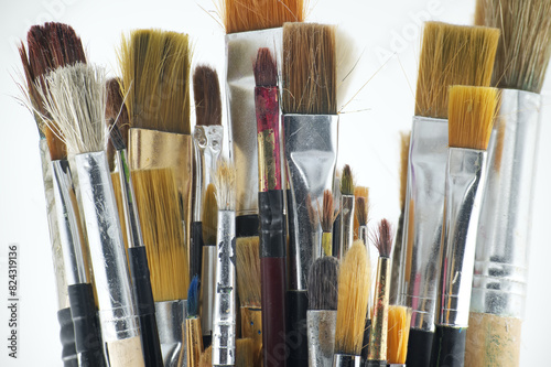 Assortment of various types and sizes of paintbrushes