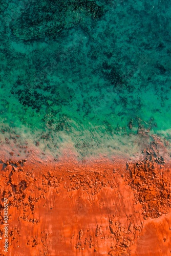 Aerial View of Orange Red Rocky Beach and Turquoise Water Kimberley