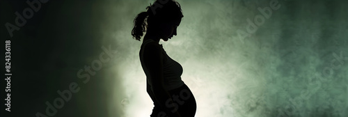 Contemplative Woman in Silhouette Reflecting on the Emotional and Psychological Impact of Abortion photo
