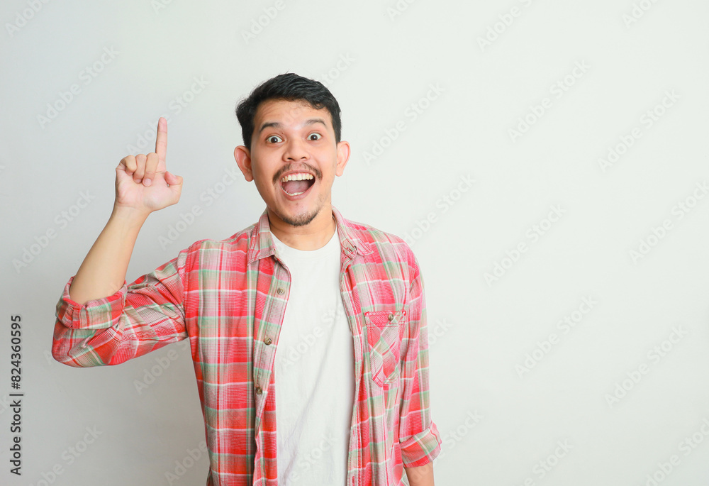 an asian man smiles and points to something with his hand, advertising concepts an asian man smiles and points to something with his hand, advertising concepts