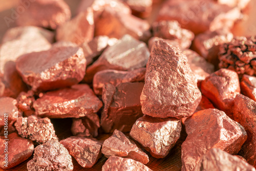 Pink gold or copper ore lump from mine texture background