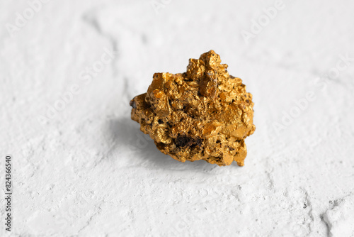 Gold ore lump from mine on white background