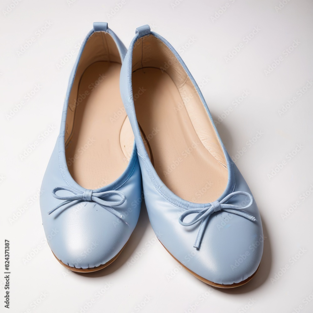 Blue ballet flats stand out against a crisp white backdrop, elegant and timeless in their simplicity Blue ballet flats stand out against a crisp white backdrop, elegant and timeless in their simplicity