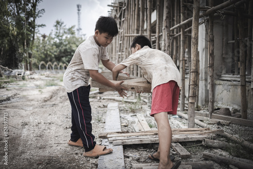  Poor children are forced to work in construction. are forced to work in the construction area. Human rights concepts, stopping child abuse, violence, fear of child labor and human trafficking.