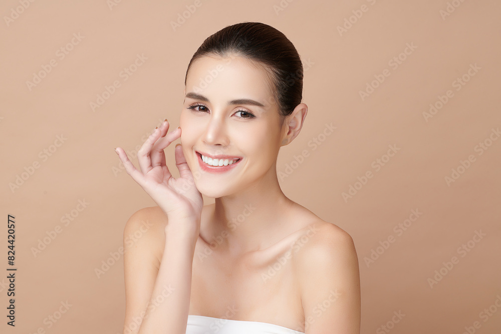 Beautiful young asian woman with clean fresh skin on beige background, Face care, Facial treatment, Cosmetology, beauty and spa, Asian women portrait.