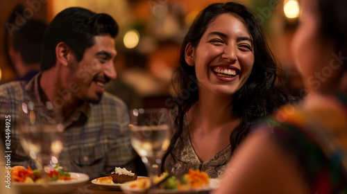 Friends gathered at a vibrant Mexican restaurant  their faces lit up with smiles as they savored the delicious cuisine and engaged in enthusiastic conversation  the background blurred