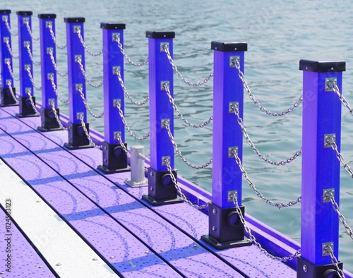 Railing at raft with sea background, Chain and pole detail on raft