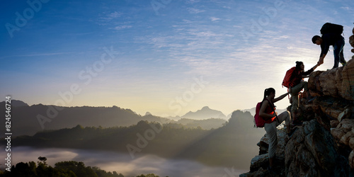 Asian hiking help each other on mountains