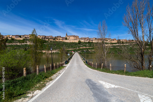 Bridge road over the Linares reservoir and Maderuelo in the background. Segovia  Castile and Leon  Spain.