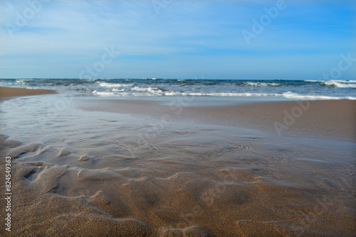 Cyprus sandy beaches. Cyprus Alagadi Turtle Beach. View from the beach to the sea. Magnificent beach, sea and blue cloudy sky.	