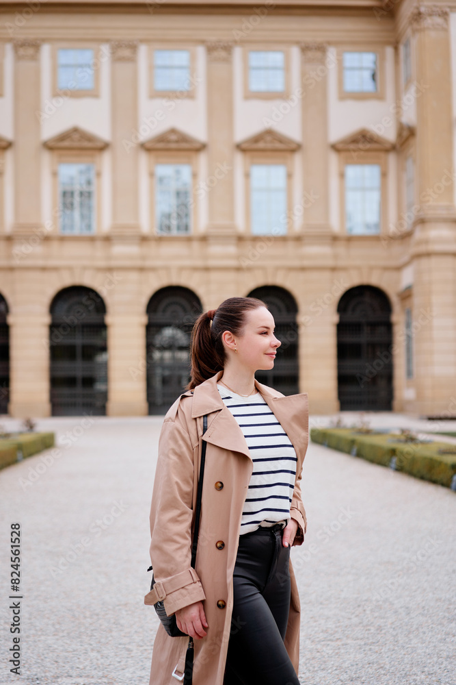 Portrait of beautiful caucasian woman wearing coat is walking by Wien street. Portrait of beautiful caucasian woman wearing coat is walking by Wien street.