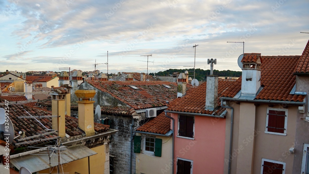 Obraz premium Town with traditional red roofs . Tiled rooftops and facades with from above 