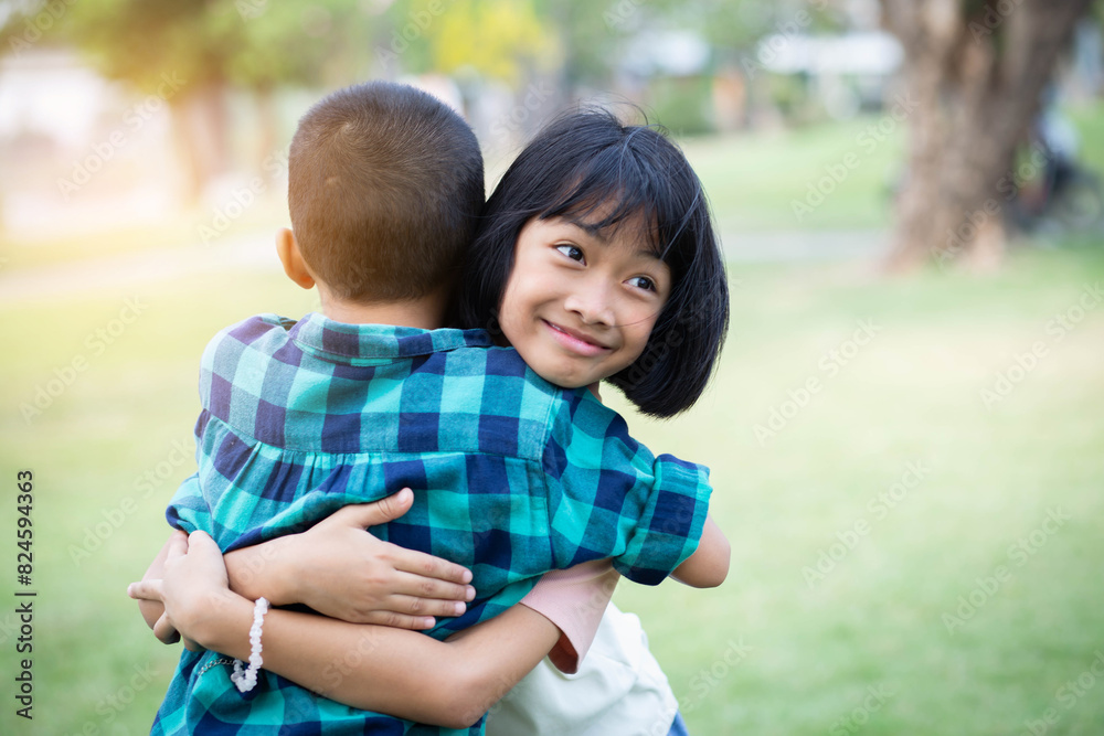 Portrait of happy boy and girl embracing each other Portrait of happy boy and girl embracing each other