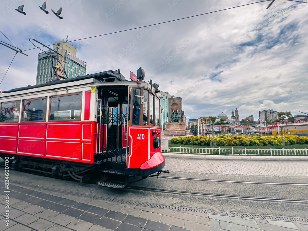 Ataturk statue and nostalgic tram in Taksim square in Istanbul