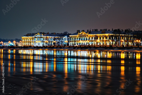 Winter Palace in Saint Petersburg illuminated at night  reflecting in the Neva River