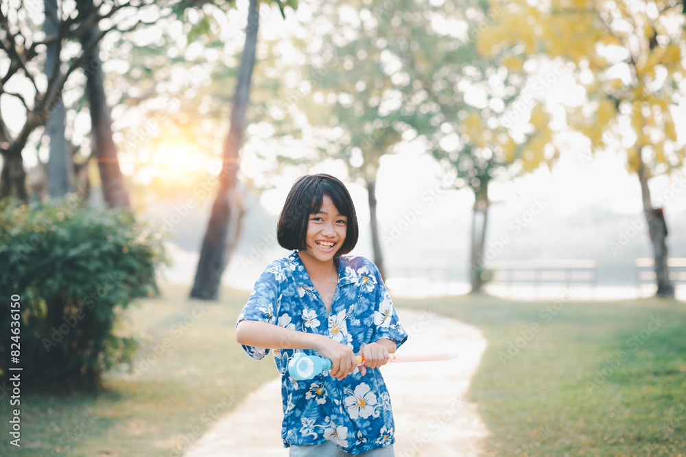 Portrait of a cheerful girl blowing soap bubbles