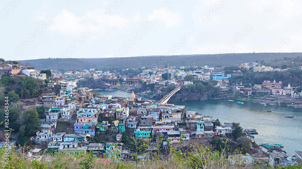 View of Mandhata Island and Omkareshwar Town, Omkareshwar, Madhya Pradesh, India. View of Mandhata Island and Omkareshwar Town, Omkareshwar, Madhya Pradesh, India.